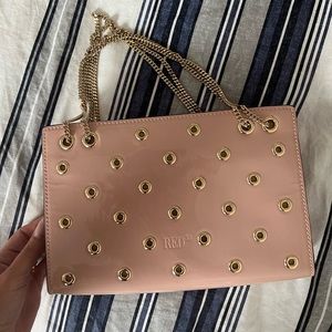 •   Red Valentino Shoulder Bag
•   Gold-Tone Hardware
•   Includes Dust Bag